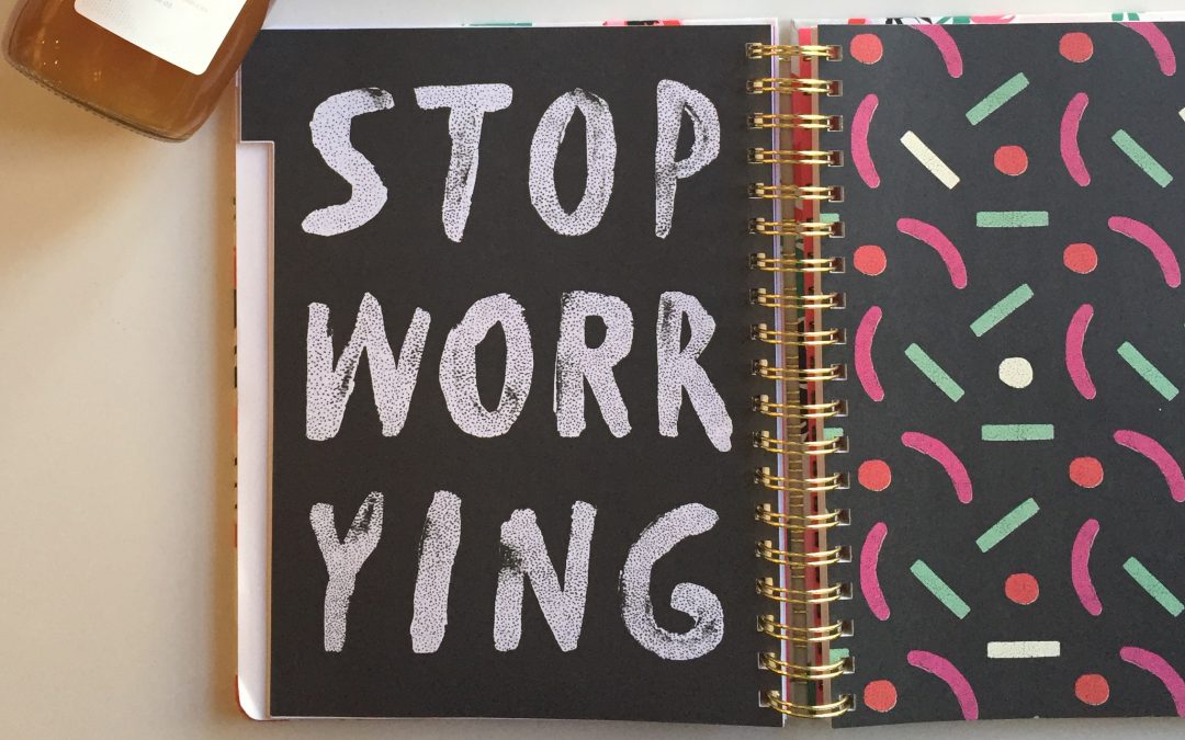 spiral notebook says "stop worrying"